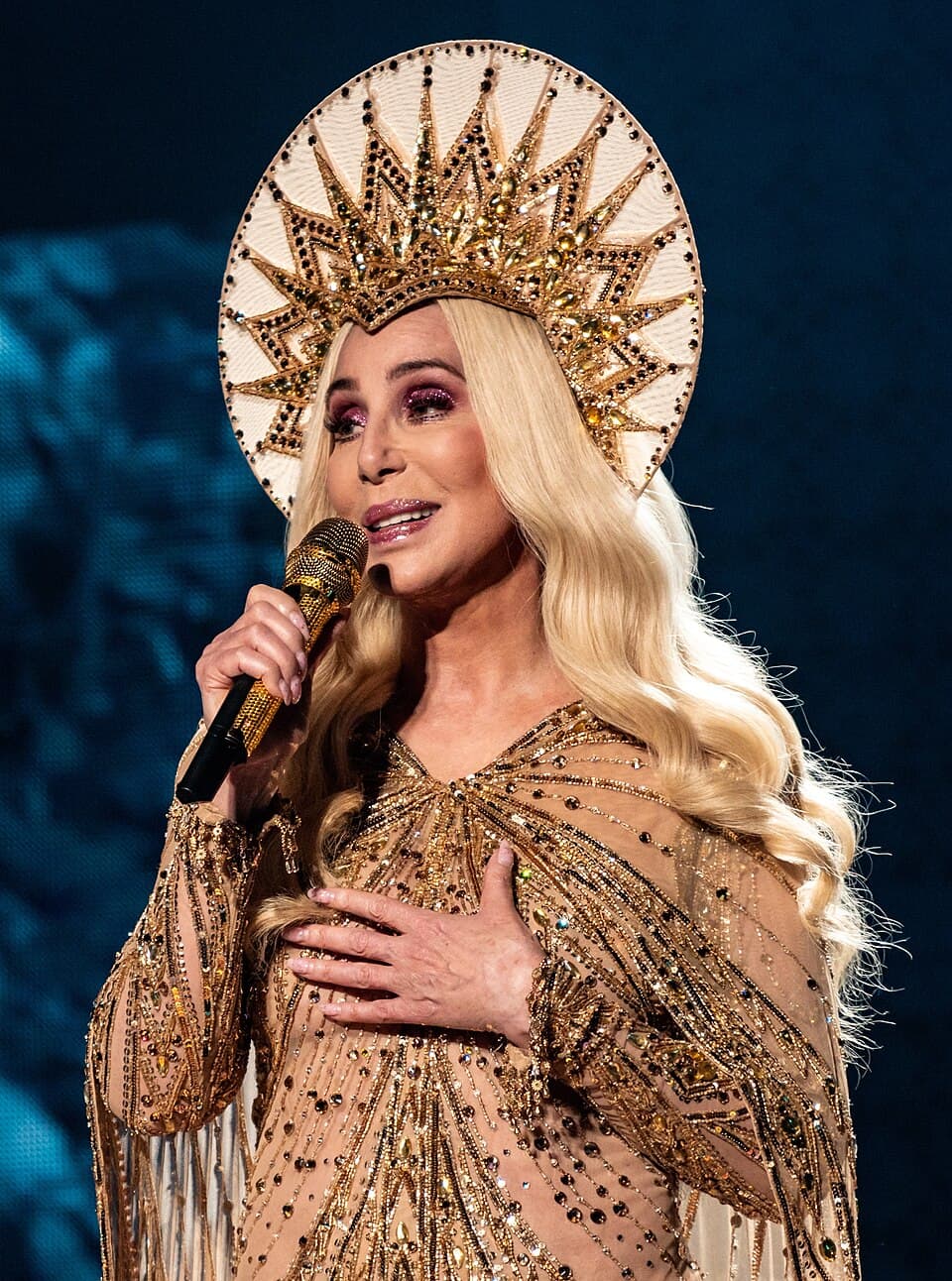 Cher performing during a public concert tour