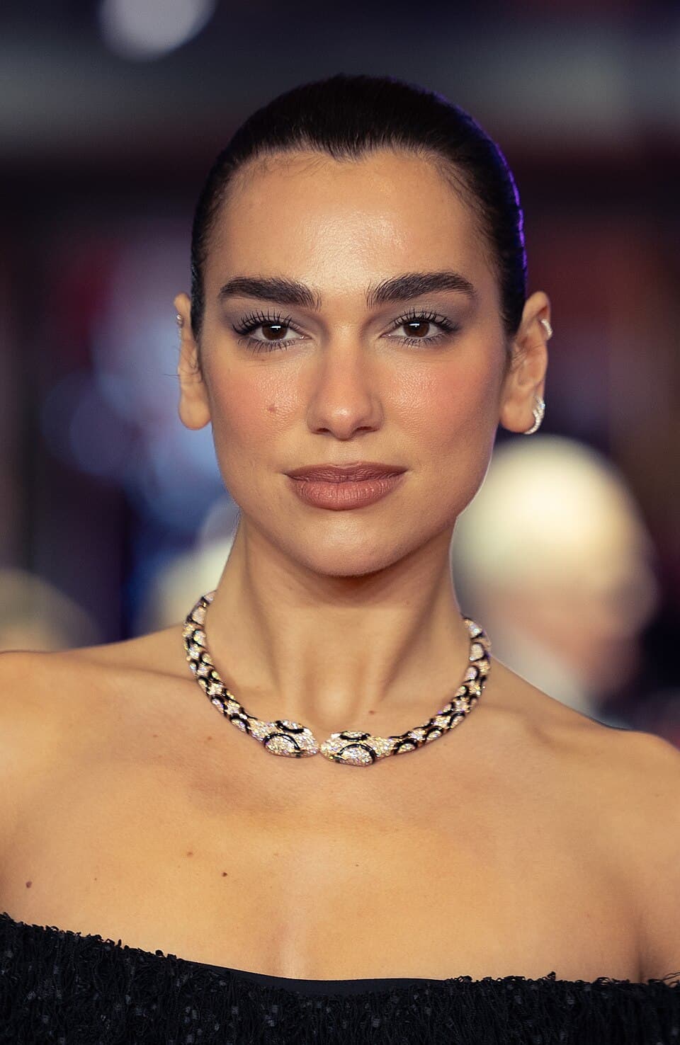 Dua Lipa performing at a public music festival